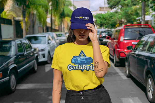 Driver in CashRyde shirt and hat on a city street